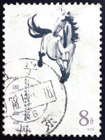 CHINA - CIRCA 1978: A stamp printed running horse, circa 1978. This traditional Chinese painting was painting by outstanding paintings masters Xu Beihong.の写真素材