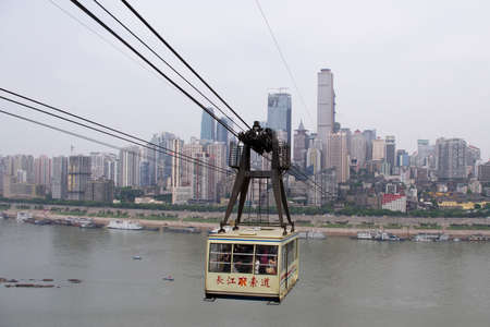Chongqing, China - April 21, 2013: Cable Car on Yangzi river. Passengers travel by cable car from side to other side of the river.のeditorial素材