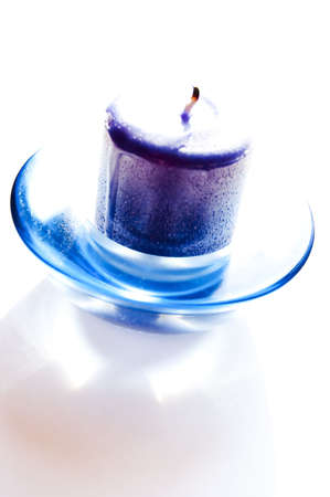 A fresh blue candle isolated on whiteの写真素材