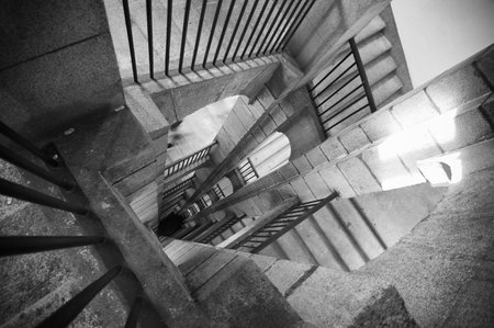 A black and white stair with shadows and light