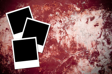 Three photos isolated on a cracked red background