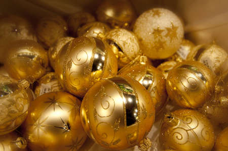 Many yellow christmas balls one on othersの写真素材