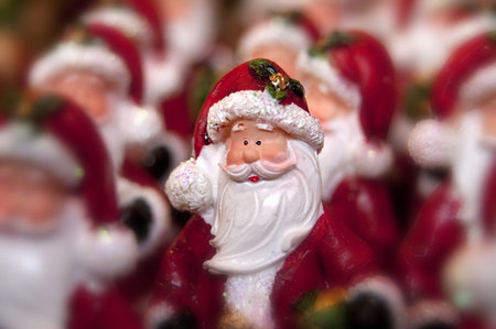 Many little statue of santa clause and one in focusの写真素材