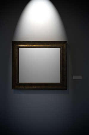 An aged frame on a dark wallの写真素材