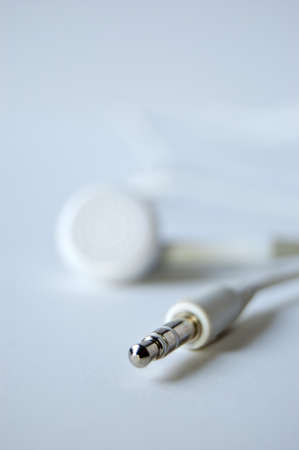 White headphones and his connector isolated on whiteの写真素材