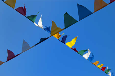 Many colored flags moved by the windの写真素材