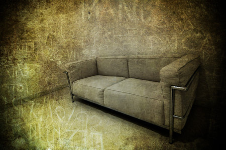A grey sofa in a textured roomの写真素材