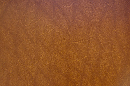 A close up of a brown raw leather