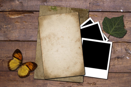 An isolated old grunge paper on a wooden background