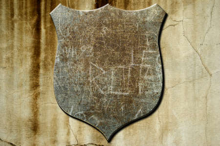 A metal shield on a concrete backgroundの写真素材