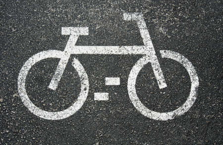 White painted sign for bikes on asphaltの写真素材