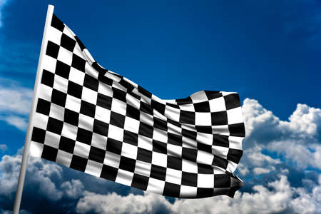 Close up of a checkered flag in a blue skyの写真素材