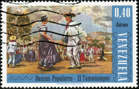 CIRCA 1966  A stamp printed in Venezuela showing traditional venezuelan dance, circa 1966の写真素材