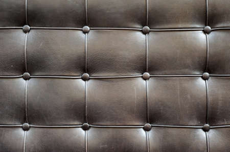 Luxury brown fabric texture on an old sofaの写真素材