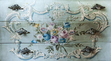 Detail of drawer carving with flowers and handlesの写真素材