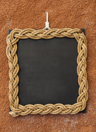 Rope frame on a blackboard used lika a copyspaceの写真素材