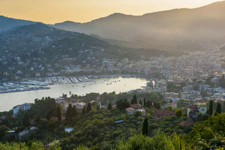 The city of Rapallo in Liguria, Italy, in a sunsetの写真素材