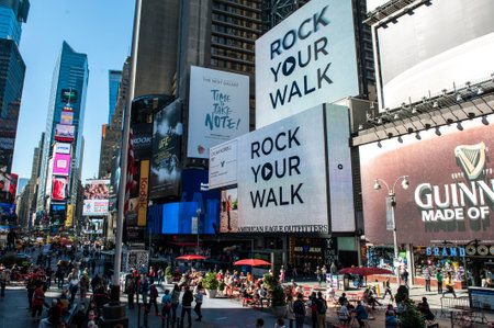 NEW YORK CITY - SEPTEMBER 18: Times Square, featured with Broadway Theaters and animated LED signs, is a symbol of New York City and the United States, September 18, 2013 in Manhattan, New York City.のeditorial素材