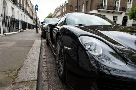 Luxury car parked in old European city street