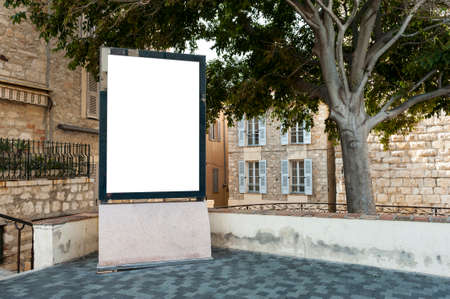 Empty vertical billboard in a place under a treeの写真素材