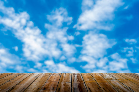 Empty wooden deck table with dusk sky backgroundの写真素材