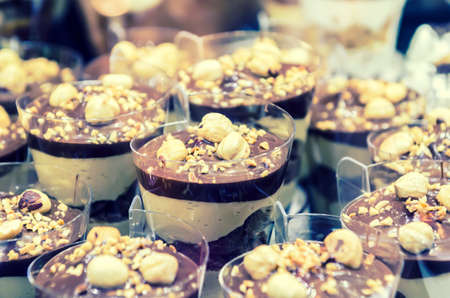 Close up on many little coffee cakesの写真素材