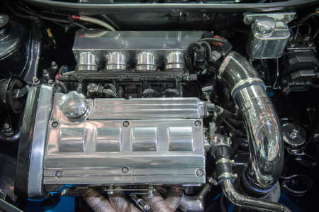 Close up of a modern chrome car engineの写真素材