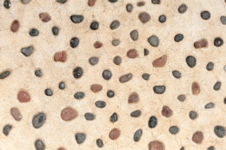 Texture of stones in a yellow wall - background