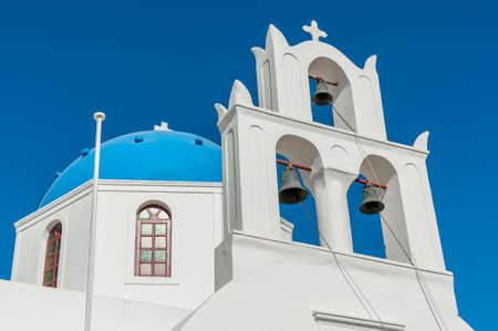 Orthodox church with blue dome in Santorini - Greeceの写真素材
