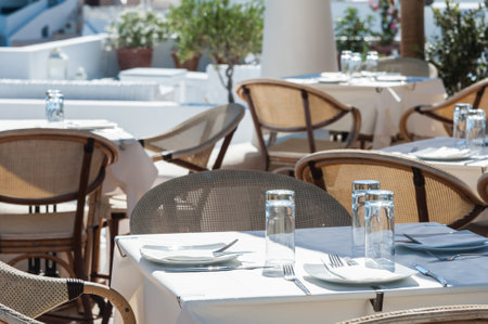 Restaurant in the sun of Santorini island - Greeceのeditorial素材