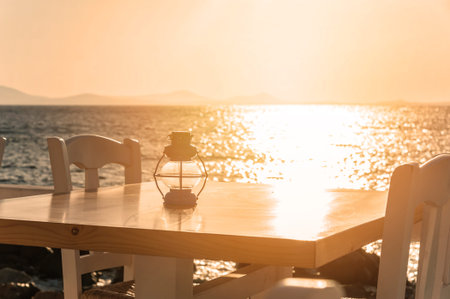 Table on the beach at sunset in Naxos, Greece