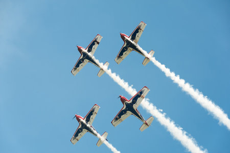 Four airplanes on airshow in formationのeditorial素材