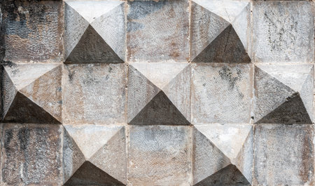Grunge concrete background with pyramidal shapes