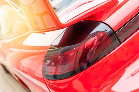 Back of a red car in the sunlight