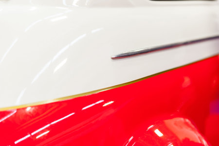 Closeup of a red and white vintage car