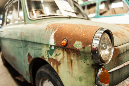 Close up on a rusted green old car