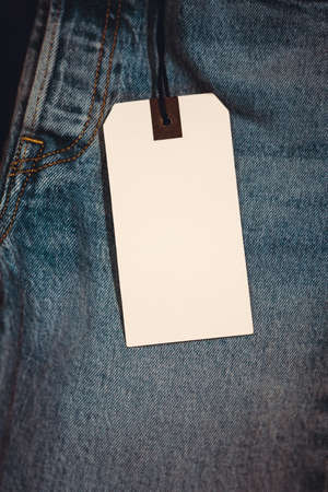 Blue jeans detail with blank tag.の写真素材