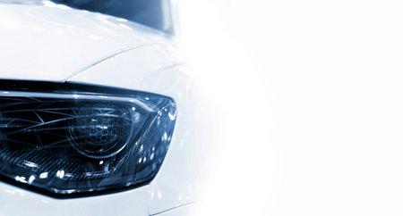 Front of a luxury car with white copyspace