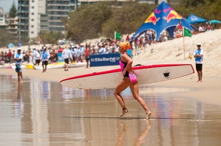 GOLD COAST, SURFERS PARADISE, QLD,  AUSTRALIA - Feb. 2013: A. Bennett (15) competes on the round four of the Surf Ironwoman Series National Championship on February 09th 2013, Gold Coast Australia.のeditorial素材