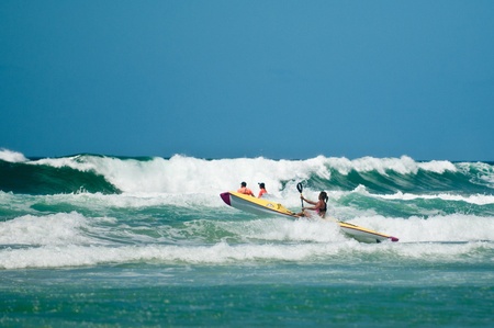 GOLD COAST, SURFERS PARADISE, QLD,  AUSTRALIA - Feb. 2013: An athlete  competes in the boarding stage on the round four of the Surf Ironwoman Series National Championship on February 09th 2013, Gold Coast Australia.のeditorial素材