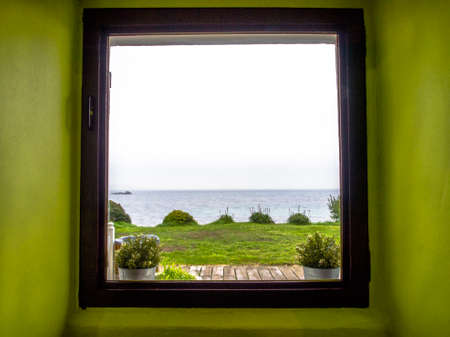 Sea view from a window in a green room. Pontevedra, Galicia, Spain.の写真素材