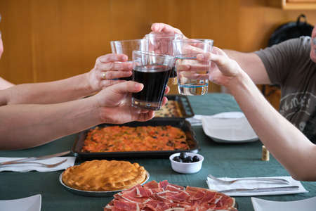 Family toasting before eating. Reunion family concept. Toast.の写真素材