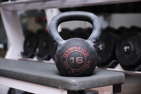 Madrid, Spain. November 29, 2020: Close up of a used, dirty and old Gymstick pro kettlebell 16 at a gym.のeditorial素材