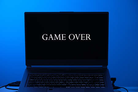 Game over on laptop screen. Blue light.の写真素材
