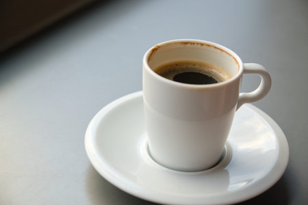 Close up of an unfinished cup of coffee.