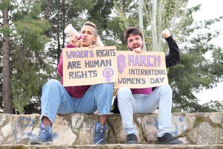 Feminist holding protests banners with feminist slogans and shouting.の写真素材