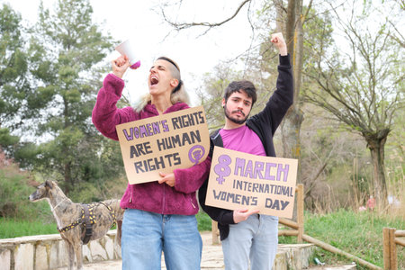 Feminist holding protests banners with feminist slogans and shouting.の写真素材