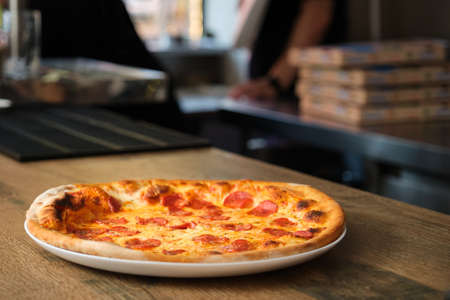 Freshly baked pepperoni pizza at a pizzeria restaurant. Pizzeria.の写真素材