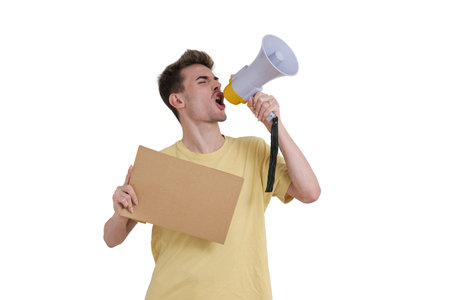 Young caucasian man shouting through megaphone holding a banner, isolated on white background.