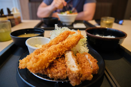 Tonkatsu set with prawn. Panko breaded deep fried pork cutlet served with shredded cabbage.の写真素材